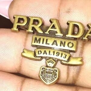 Prada Metallic Gold Emblem Pin